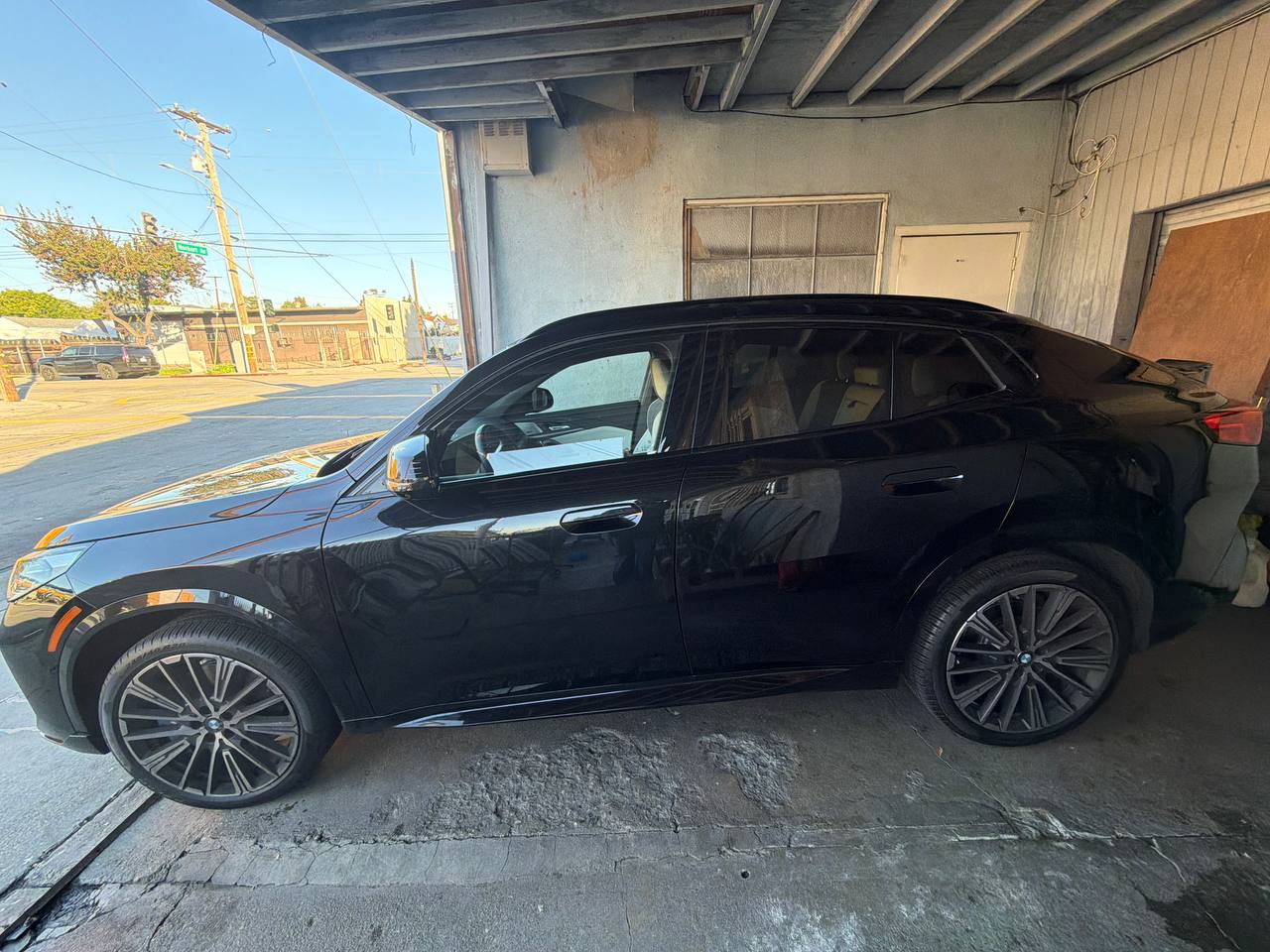 Black BMW M — before tint, side view